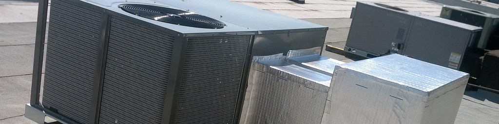 Commercial Air Conditioning units installed on roof by Reader Heating and Cooling.